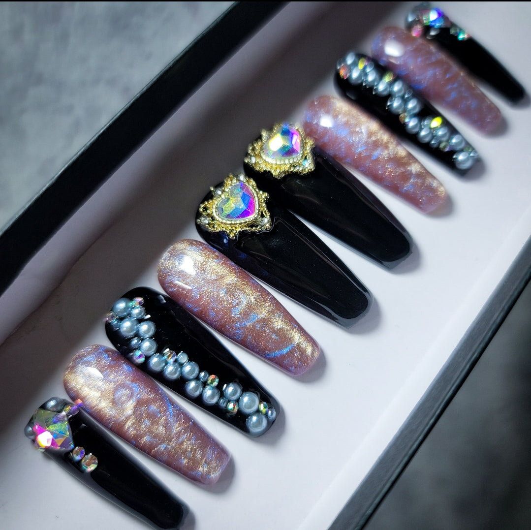 So much glitter and Swarovski stones on coffin gel nails